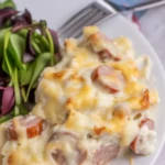 Cheesy Ranch Potatoes and Smoked Sausage casserole in a baking dish